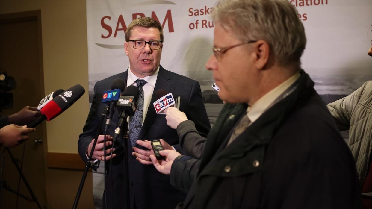 Saskatchewan Premier Scott Moe speaks with reporters during the 2024 Saskatchewan Association of Rural Municipalities convention in Regina on Thursday. (Cory Herperger/CBC News - image credit)