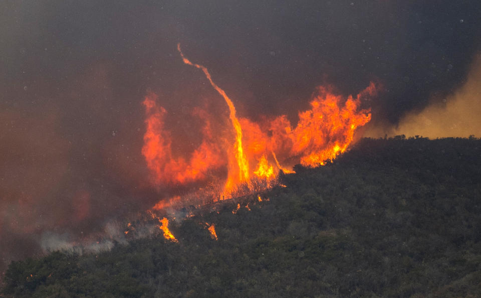 <p>The Holy Fire burns in the Cleveland National Forest behind homes along Crystal Ridge Court in Lake Elsinore, Calif., Wednesday, Aug. 8, 2018. (Photo: Mark Rightmire/The Orange County Register via AP) </p>