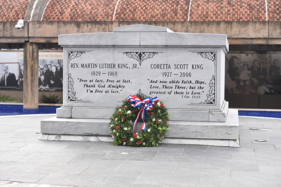 The tomb of Martin Luther King Jr. and his wife, <span class="caas-xray-inline-tooltip"><span class="caas-xray-inline caas-xray-entity caas-xray-pill rapid-nonanchor-lt" data-entity-id="Coretta_Scott_King" data-ylk="cid:Coretta_Scott_King;pos:3;elmt:wiki;sec:pill-inline-entity;elm:pill-inline-text;itc:1;cat:Writer;" tabindex="0" aria-haspopup="dialog"><a href="https://search.yahoo.com/search?p=Coretta%20Scott%20King" data-i13n="cid:Coretta_Scott_King;pos:3;elmt:wiki;sec:pill-inline-entity;elm:pill-inline-text;itc:1;cat:Writer;" tabindex="-1" data-ylk="slk:Coretta Scott King;cid:Coretta_Scott_King;pos:3;elmt:wiki;sec:pill-inline-entity;elm:pill-inline-text;itc:1;cat:Writer;" class="link ">Coretta Scott King</a></span></span>, is seen during the King Holiday Observance Beloved Community Commemorative Service at the Martin Luther King Jr. Center & National Historic Site on Monday in Atlanta, Georgia. (Photo by Paras Griffin/Getty Images)