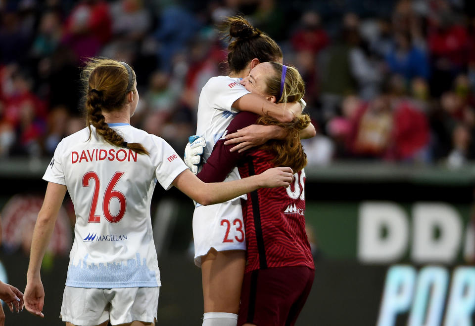 Goalkeeper Cassie Miller celebrates with teammates Tatumn Milazzo and Tierna Davidson after the match against the Portland Thorns FC on November 14, 2021 in Portland, Oregon. (Photo by Steve Dykes/Getty Images)