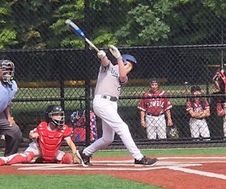 Dover's Connor Lynch hits a three-run double in the third inning of a New England Cal Ripken baseball 11-year-old regional tournament game against Hudson, Massachusetts, Sunday, July 17, 2022 in New Canaan, Connecticut. Dover won, 15-0, in three innings.