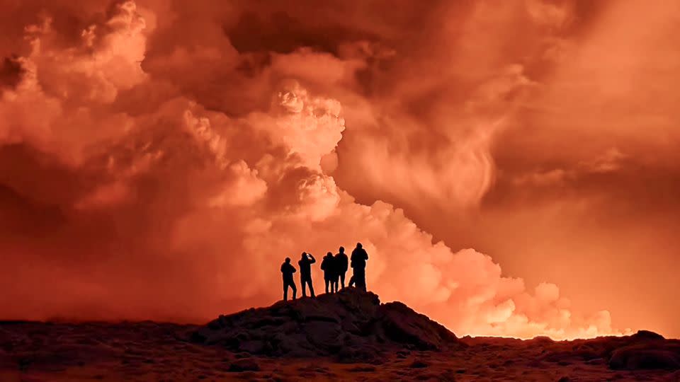 Local residents watch smoke billowing following the eruption in western Iceland on Monday night. - Kristin Elisabet Gunnarsdottir/AFP/Getty Images