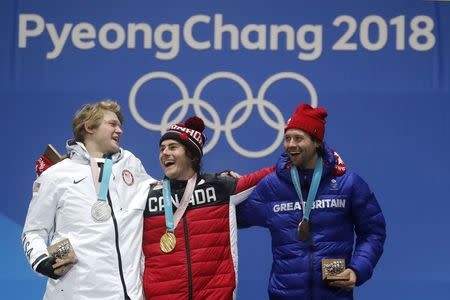 Medals Ceremony - Snowboarding - Pyeongchang 2018 Winter Olympics - Men's Big Air - Medals Plaza - Pyeongchang, South Korea - February 24, 2018 - Gold medalist Sebastien Toutant of Canada, silver medalist Kyle Mack of the U.S., and bronze medalist Billy Morgan of Britain on the podium. REUTERS/Jorge Silva