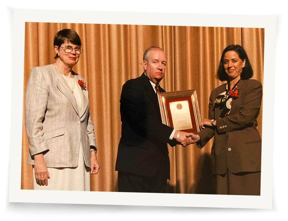 Amie Clark, San Francisco-based DEA special agent, right, receives the Administrator's Award from DEA chief Thomas Constantine for her work investigating the interior designers. They are flanked by then-Attorney General Janet Reno.