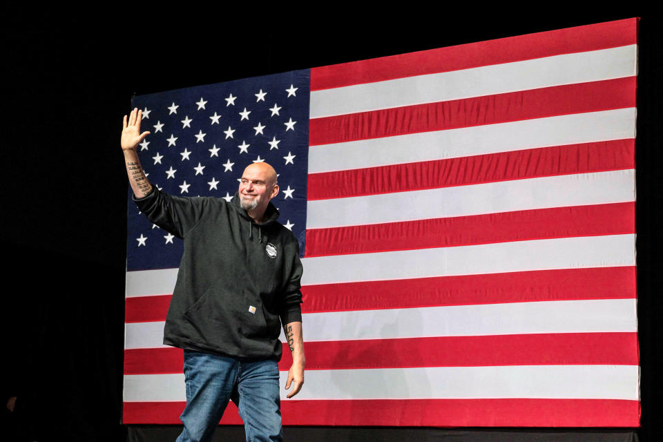Image: Pennsylvania Democratic Senatorial candidate John Fetterman waves as he arrives onstage at a watch party during the midterm elections at Stage AE in Pittsburgh, Pa., on Nov. 8, 2022. (Angela Weiss / AFP - Getty Images)