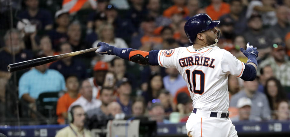 Houston Astros' Yuli Gurriel watches his two-run home run against the Colorado Rockies during the second inning of a baseball game Wednesday, Aug. 15, 2018, in Houston. (AP Photo/David J. Phillip)