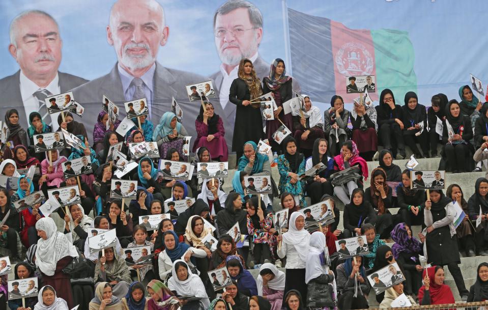 Female supporters of Afghan presidential candidate Ashraf Ghani Ahmadzai listen to his speech during a campaign rally in Kabul, Afghanistan, Tuesday, April 1, 2014. Eight Afghan presidential candidates are campaigning for the third presidential election. Elections will take place on April 5, 2014. (AP Photo/Massoud Hossaini)