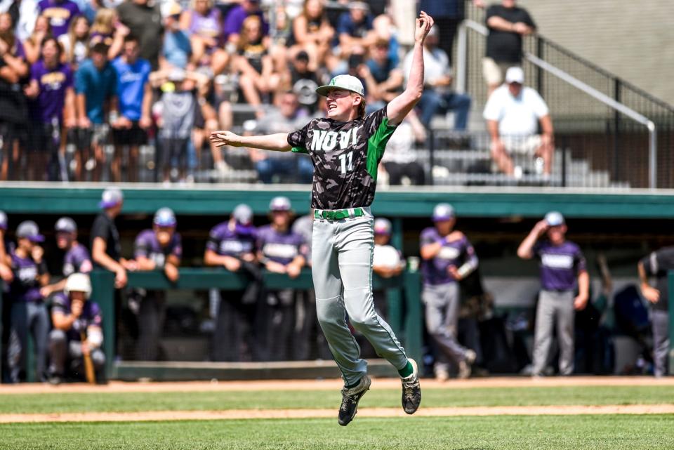 Novi pitcher Uli Fernsler celebrates after beating Woodhaven to win the D1 baseball state championship on Saturday, June 17, 2023, at McLane Stadium on the MSU campus in East Lansing.