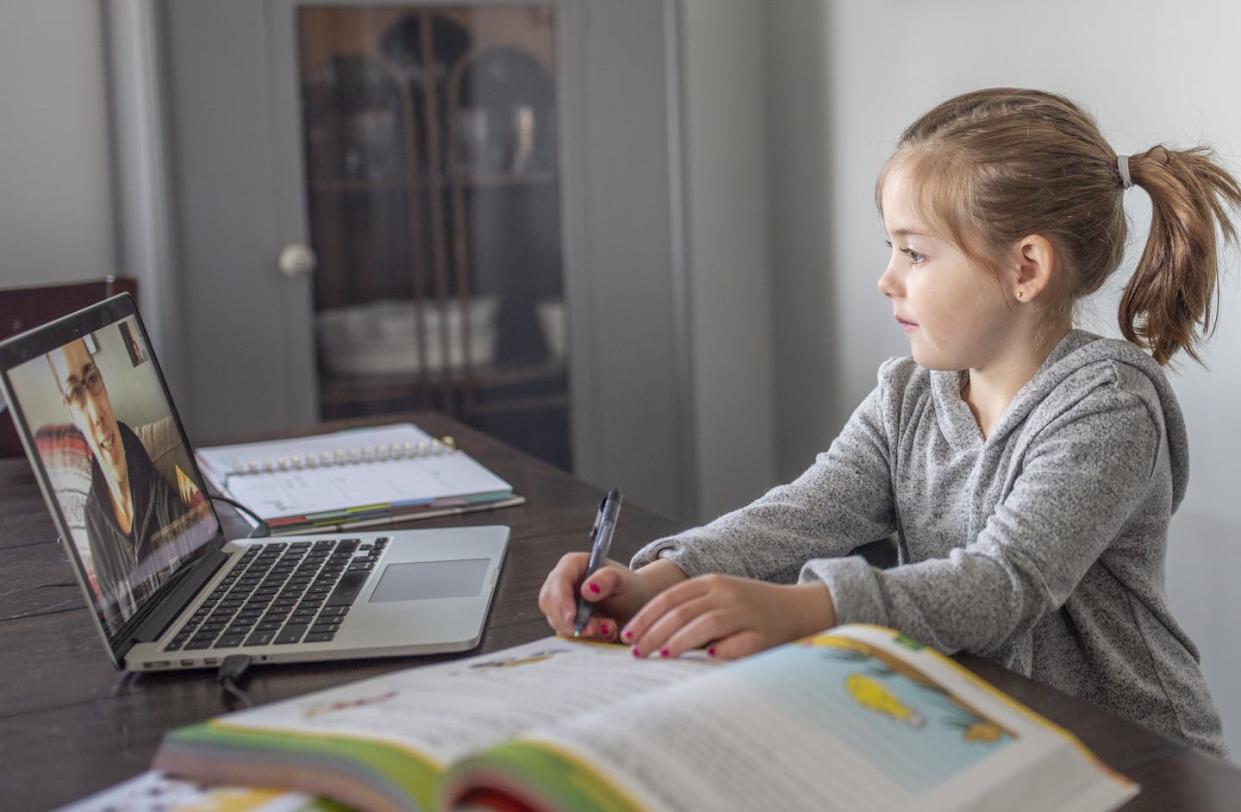 Programs that brought internet access to rural students are set to expire. <a href="https://www.gettyimages.com/detail/photo/elementary-aged-girl-learns-from-home-royalty-free-image/1273782190?phrase=student+home+laptop+young+student&adppopup=true" rel="nofollow noopener" target="_blank" data-ylk="slk:FatCamera via Getty Images;elm:context_link;itc:0;sec:content-canvas" class="link ">FatCamera via Getty Images</a>