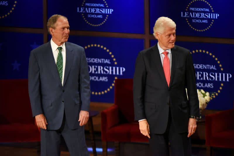 FILE PHOTO: Former U.S. Presidents George W. Bush and President Bill Clinton congratulate graduates of their Presidential Leadership Scholars program