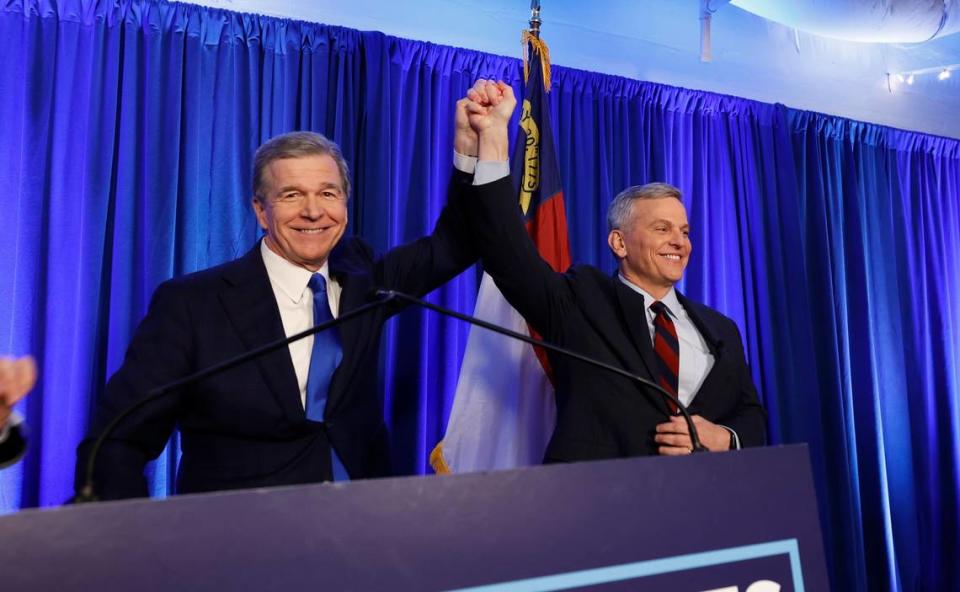 Gov. Roy Cooper celebrates with Attorney General Josh Stein after he won the Democratic primary for governor during a North Carolina Democrats primary election night party at Maywood Hall and Gardens in Raleigh, N.C., Tuesday, March 5, 2024.