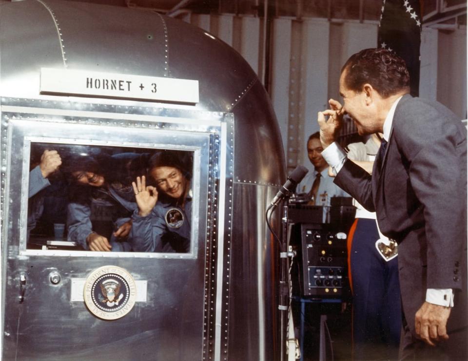 <div class="inline-image__title">476974335</div> <div class="inline-image__caption"><p>President Richard Nixon and the Apollo 11 astronauts exchange “A-OK” signs through the window of the Mobile Quarantine Facility on July 25, 1969, aboard the USS Hornet. Astronauts (L-R) <span class="caas-xray-inline-tooltip"><span class="caas-xray-inline caas-xray-entity caas-xray-pill rapid-nonanchor-lt" data-entity-id="Neil_Armstrong" data-ylk="cid:Neil_Armstrong;pos:3;elmt:wiki;sec:pill-inline-entity;elm:pill-inline-text;itc:1;cat:Actor;" tabindex="0" aria-haspopup="dialog"><a href="https://search.yahoo.com/search?p=Neil%20Armstrong" data-i13n="cid:Neil_Armstrong;pos:3;elmt:wiki;sec:pill-inline-entity;elm:pill-inline-text;itc:1;cat:Actor;" tabindex="-1" data-ylk="slk:Neil Armstrong;cid:Neil_Armstrong;pos:3;elmt:wiki;sec:pill-inline-entity;elm:pill-inline-text;itc:1;cat:Actor;" class="link ">Neil Armstrong</a></span></span>, Michael Collins, and Buzz Aldrin splashed down in the Pacific Ocean on July 24, 900 miles southwest of Hawaii at the completion of their successful lunar landing mission. </p></div> <div class="inline-image__credit">NASA/AFP/Getty</div>