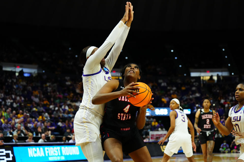 BATON ROUGE, LA - MARCH 19: Jackson State Lady Tigers center Ameshya Williams-Holliday #4 looks to shoot against LSU Tigers center Faustine Aifuwa #24 during the second half of the game between the LSU Tigers and the Jackson State Lady Tigers during the first round of the 2022 NCAA Women's Basketball Tournament held at the Pete Maravich Assembly Center on March 19, 2022 in Baton Rouge, Louisiana. (Photo by Andrew Wevers/NCAA Photos via Getty Images)