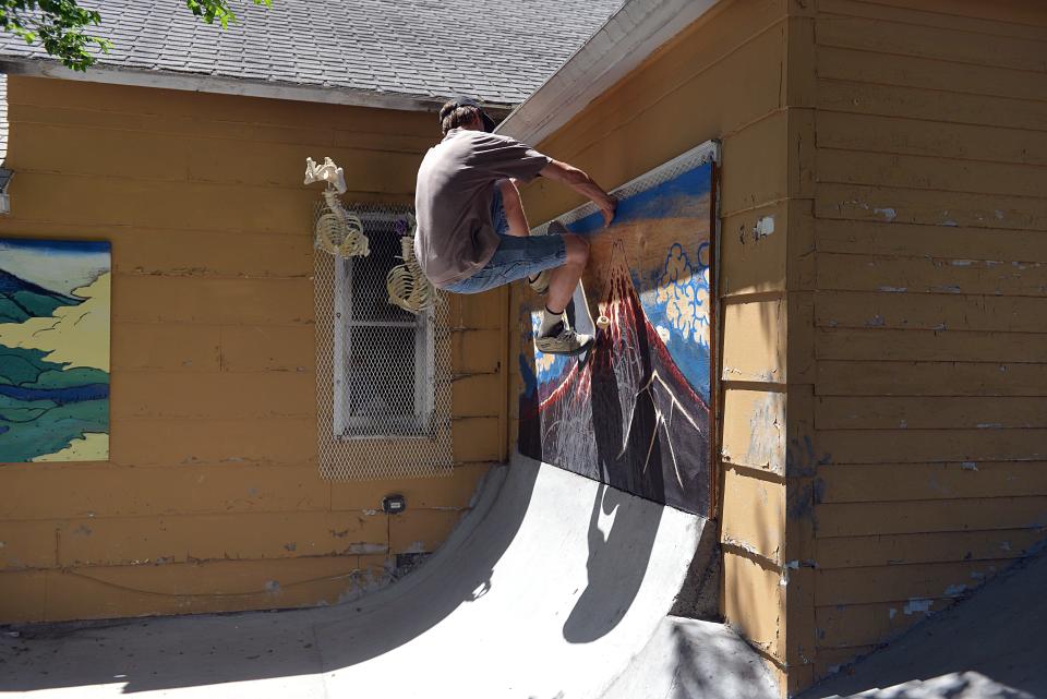 Mac Munson skates up a wall at the Oyate Park in Mission, also known as the Yellow House Skatepark, the newest build as part of the Rosebud Skatepark Development Project on Monday, June 19, 2023.