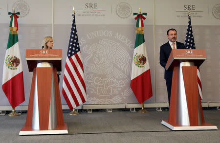 U.S. Homeland Security Secretary Kirstjen Nielsen listens to Mexico's Foreign Minister Luis Videgaray while delivering a joint message in Mexico City, Mexico March 26, 2018. REUTERS/Henry Romero