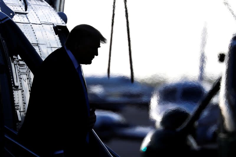 FILE PHOTO: U.S. President Donald Trump descends from Marine One at Miami Executive Airport in Miami, Florida ahead of an evangelical speaking event