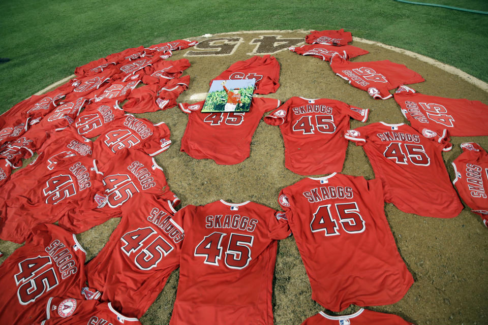 Jerseys with pitcher Tyler Skaggs' number are placed on the mound after the Los Angeles Angels completed a combined no-hitter against the Seattle Mariners during a baseball game Friday, July 12, 2019, in Anaheim, Calif. (AP Photo/Marcio Jose Sanchez)