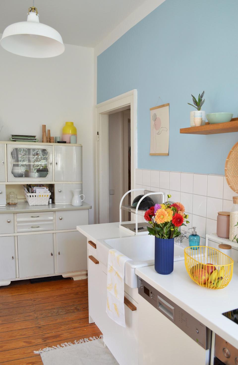 Lots of paint: Jessica is all for painting an entire room a bold hue, but their kitchen was so small that she feared floor-to-ceiling coverage would feel oppressive. Instead, she painted just one wall a cheerful baby blue, which she says reminds her of their vacation home in Sweden. Then there's the moodier shade of blue in the living room. "It's mainly our relaxing area, so I wanted a color to calm us and look noble at the same time," Jessica explains.