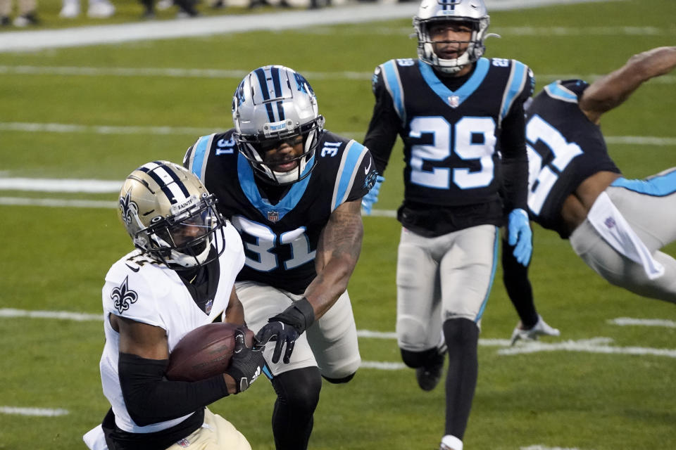 New Orleans Saints wide receiver Emmanuel Sanders scores past Carolina Panthers strong safety Juston Burris during the first half of an NFL football game Sunday, Jan. 3, 2021, in Charlotte, N.C. (AP Photo/Gerry Broome)