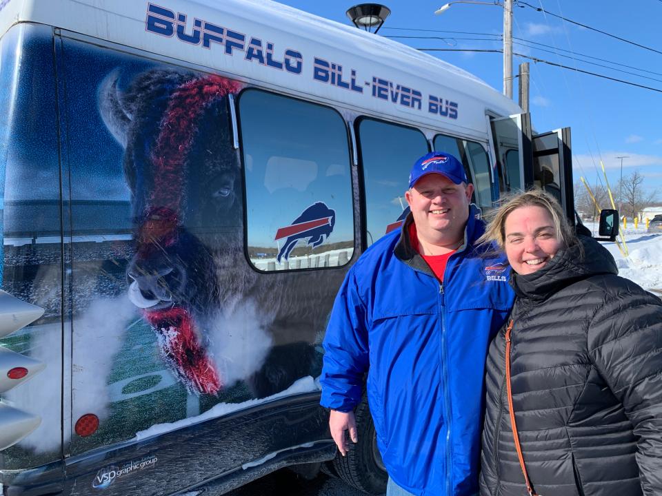 Marco and Kari Cercone outside Marco's "Buffalo Bill-iever Bus," a 14-passenger van that gets 7.8 miles to the gallon but demonstrates Marco's lifelong love of his hometown team. Says Kari: "I root for the Bills 100%. But I root 101%, so he gets a win because he's just a much happier guy when they win."