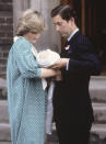 FILE - In this June 22, 1982 file photo Britain's Prince Charles, Prince of Wales, with his wife Princess Diana taking their newborn son Prince William, as they left St. Mary's Hospital, Paddington, London. (AP Photo/John Redman, File)