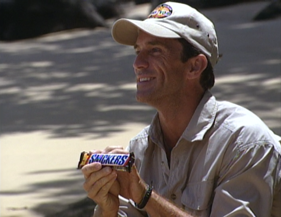 Jeff Probst holds a Snickers bar