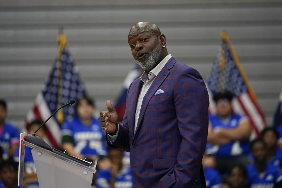 Former Dallas Cowboy and Football Hall of Famer Emmitt Smith speaks at Emmett J. Conrad High School in Dallas, Tuesday, June 29, 2021. (AP Photo/Carolyn Kaster, Pool)