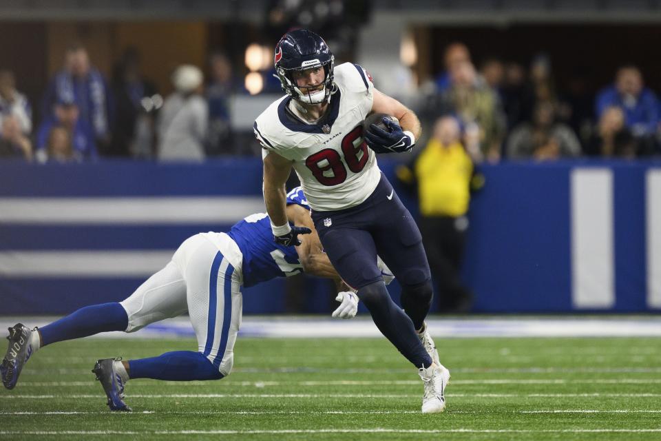 Houston Texans tight end Dalton Schultz runs through the tackle of Indianapolis Colts cornerback Darrell Baker Jr. during a game, Saturday, Jan. 6, 2024, in Indianapolis. | Zach Bolinger, Associated Press
