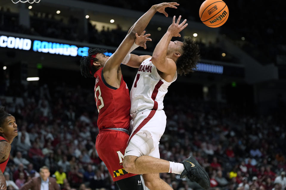 Maryland guard Ian Martinez (23) defends against Alabama guard Mark Sears (1) during the second half of a second-round college basketball game in the men's NCAA Tournament in Birmingham, Ala., Saturday, March 18, 2023. (AP Photo/Rogelio V. Solis)