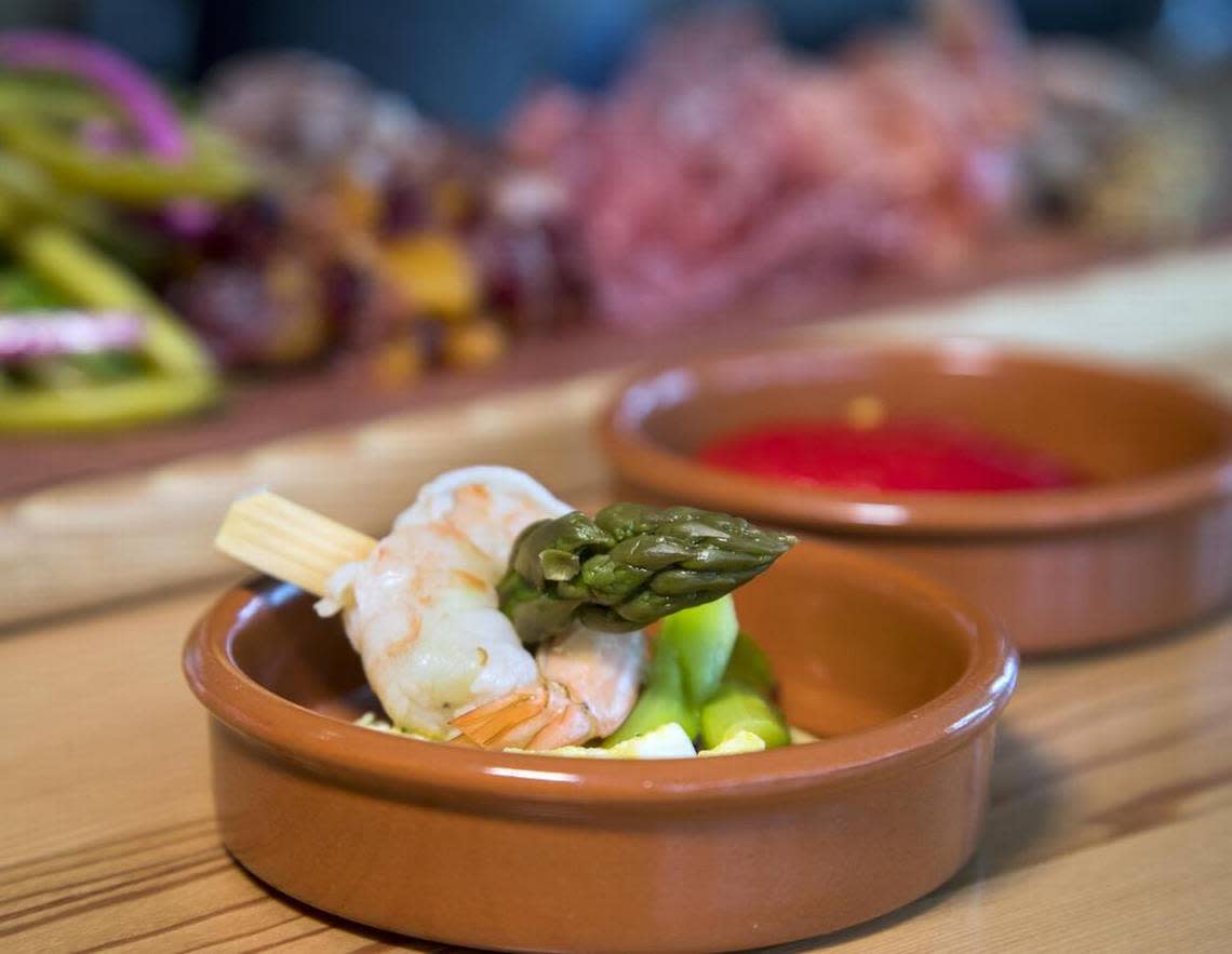 Txikiteo’s Basque-style tapas (pinxtos) feature culinary treats such as the chilled shrimp skewer served with asparagus and chopped hard-boiled egg.