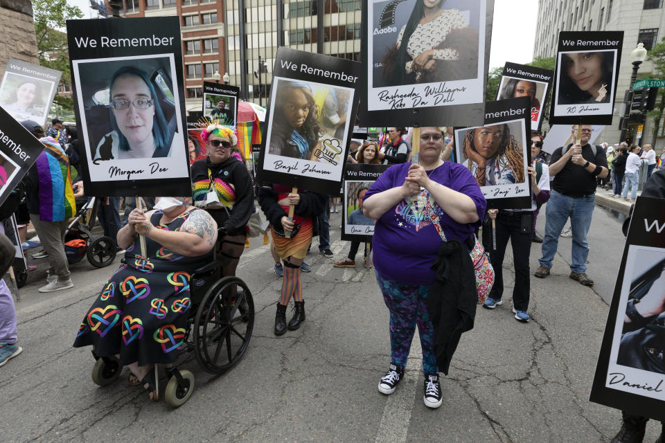 FILE - A group memorializing transgender people who died because of bias or hate in the U.S. marches in the Pride parade, Saturday, June 10, 2023, in Boston. The biggest Pride parade in New England returned on Saturday after a three-year hiatus, with a fresh focus on social justice and inclusion rather than corporate backing. (AP Photo/Michael Dwyer, File)