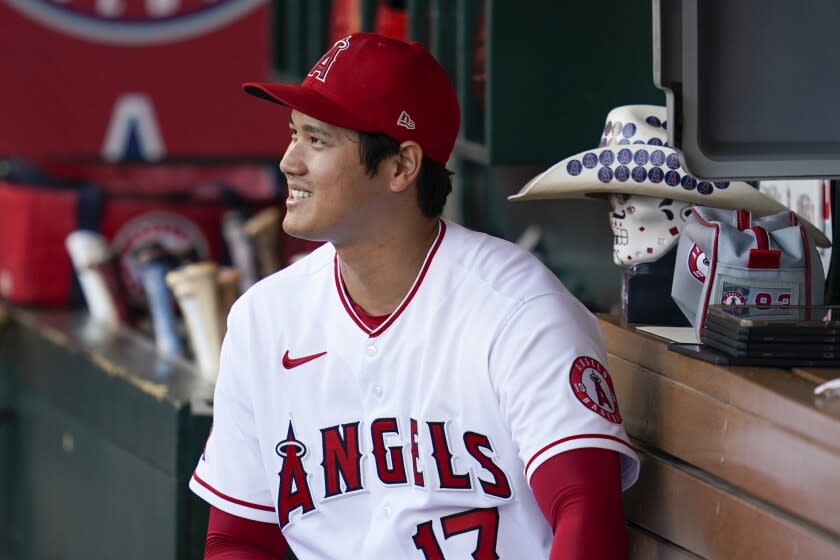 Los Angeles Angels designated hitter Shohei Ohtani (17) sits in the dugout.