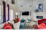<p>Neutral furnishings, including the sofa, cabinet, and coffee table, ground this colorful design from <a href="https://deringhall.com/interior-designers/wesley-wayne-interiors" rel="nofollow noopener" target="_blank" data-ylk="slk:Wesley-Wayne Interiors;elm:context_link;itc:0;sec:content-canvas" class="link ">Wesley-Wayne Interiors</a>.</p>