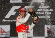 FILE PHOTO - McLaren Formula One driver Jenson Button of Britain celebrates winning the Australian F1 Grand Prix in Melbourne March 28, 2010. REUTERS/Scott Wensley/File Photo