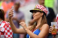 <p>Cameras out: A Croatia fan enjoys the pre-match atmosphere prior to the 2018 FIFA World Cup Final between France and Croatia. (Photo by Matthias Hangst/Getty Images) </p>