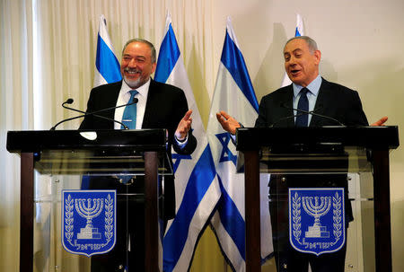 Avigdor Lieberman, head of far-right Yisrael Beitenu party, (L) and Israeli Prime Minister Benjamin Netanyahu deliver statements to the media after signing a coalition deal to broaden the government's parliamentary majority, at the Knesset, the Israeli parliament in Jerusalem May 25, 2016. REUTERS/Ammar Awad