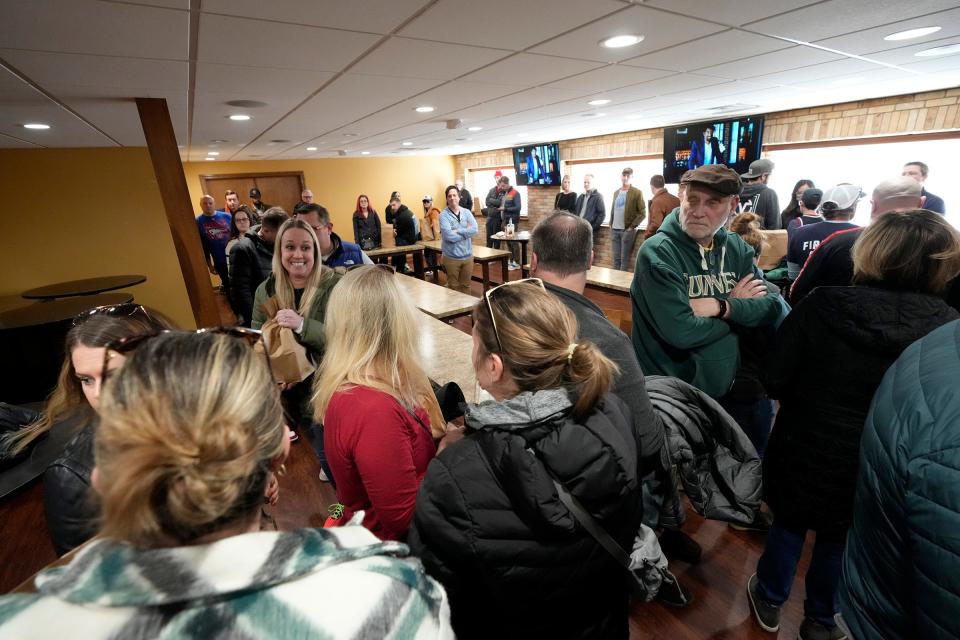 People fill a room waiting to see and get autographs from Chicago Bulls legend and 6 time NBA champion, Scottie Pippen during his stop at Ray's Wine and Spiritsin Wauwatosa on Wednesday, Feb. 8, 2023. Pippen was in town to tout and sign bottles of his Digits Whiskey for fans.