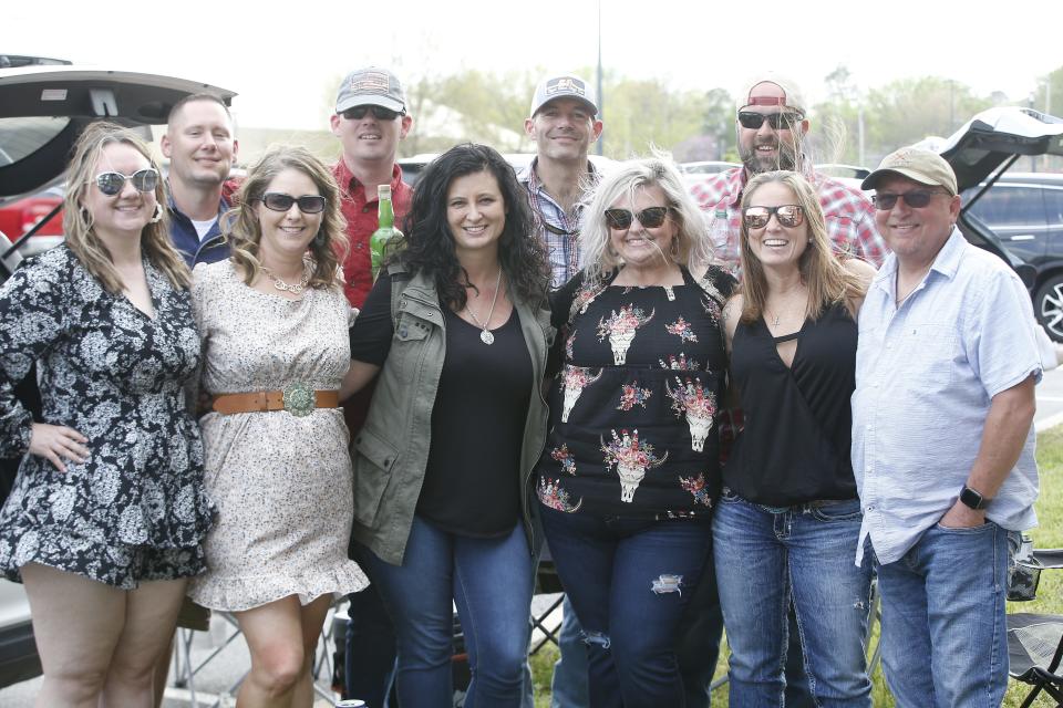 A group of 10 from Greenwood gathers at a tailgate prior to the Garth Brooks concert at the Arkansas Razorbacks football stadium. They considered the event something to take off their bucket list.