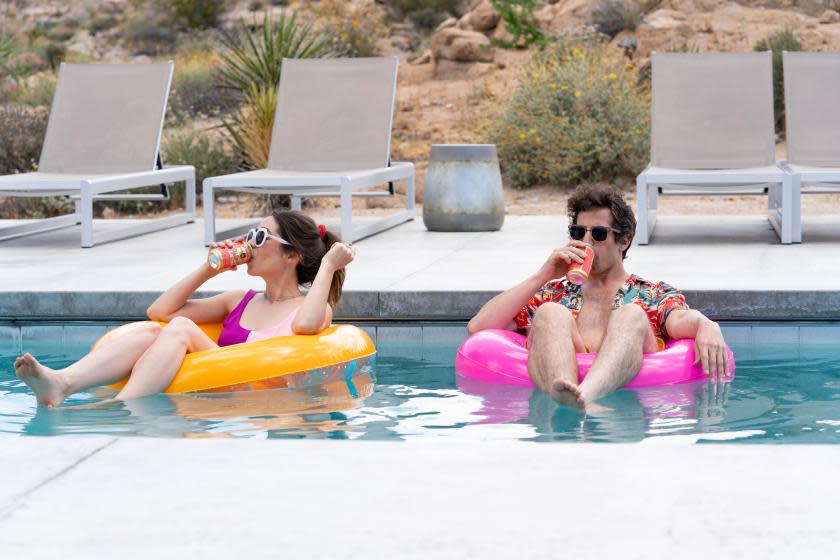 When carefree Nyles (Andy Samberg) and reluctant maid of honor Sarah (Cristin Milioti) have a chance encounter at a Palm Springs wedding, things get complicated when they find themselves unable to escape the venue, themselves, or each other. Sarah (Cristin Milioti) and Nyles (Andy Samberg),shown in "Palm Springs".(Photo by: Jessica Perez/Hulu)