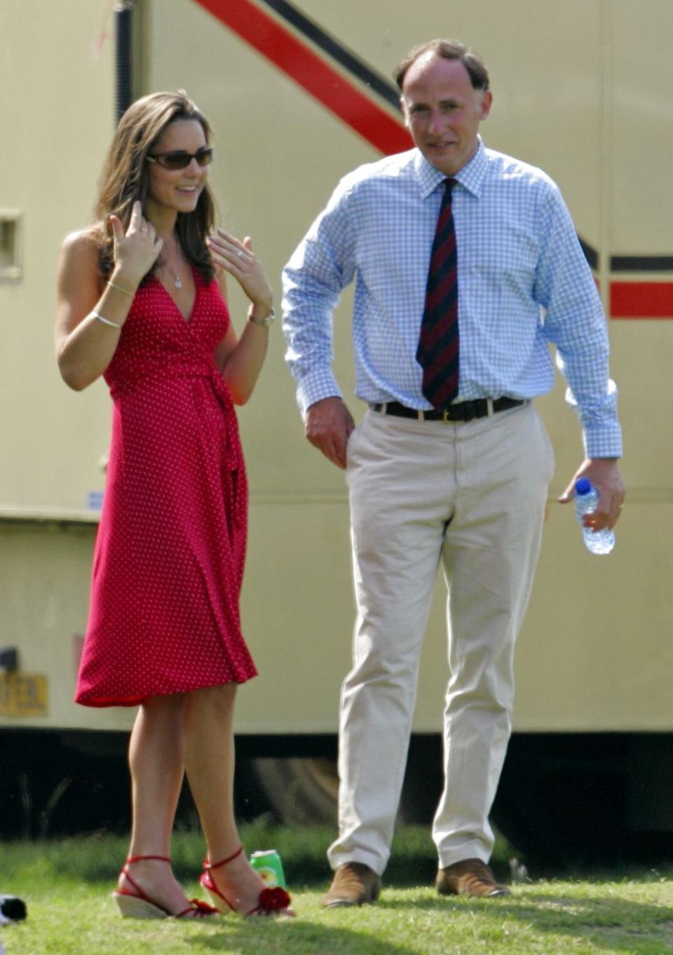<p>With Prince William's Private Secretary Jamie Lowther-Pinkerton while watching Prince William compete in the Chakravarty Cup charity polo match at Ham Polo Club in Richmond, England.</p>