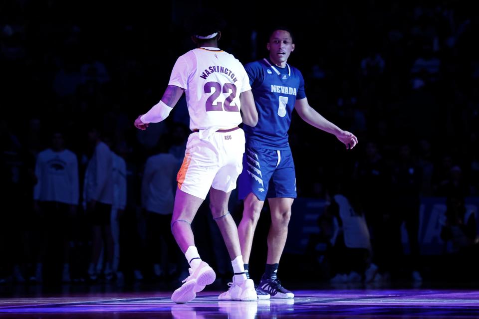 Arizona State Sun Devils forward Warren Washington (22) shakes hands with Nevada Wolf Pack forward Darrion Williams (5) prior to the start of the game at UD Arena in Dayton on March 15, 2023.