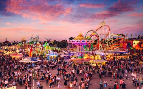 Visitors in Munich at the Oktoberfest fairgrounds - Credit: istock