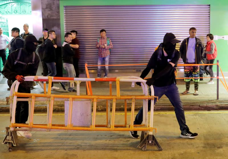 Anti-government protesters rally outside Prince Edward MTR station in Hong Kong