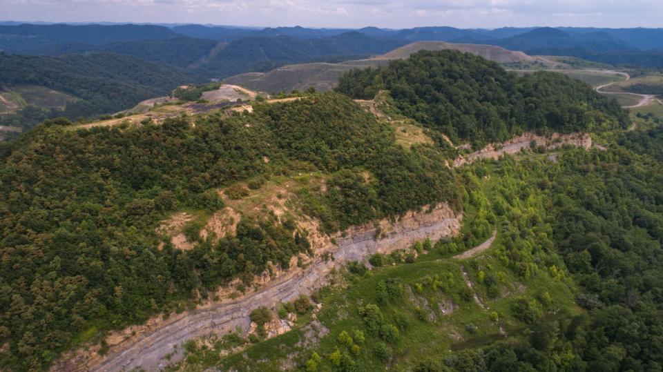 A view of the high wall left on Tracy Neece's Eastern Kentucky property after a former strip-mining operator failed to reclaim the land as promised. July 15, 2021