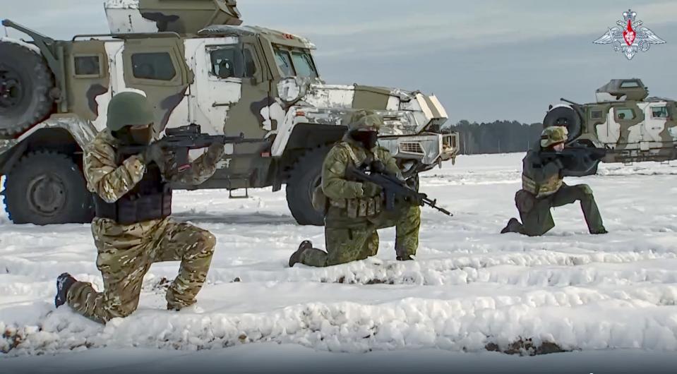 FILE - In this handout photo taken from video released by Russian Defense Ministry Press Service on Wednesday, Dec. 28, 2022, Russian troops take part in drills at an unspecified location in Belarus. Belarus President Alexander Lukashenko has welcomed thousands of Russian troops to his country, allowed the Kremlin to use it to launch the invasion of Ukraine on Feb. 24, 2022, and offered to station some of Moscow’s tactical nuclear weapons there. But he has avoided having Belarus take part directly in the fighting – for now. (Russian Defense Ministry Press Service via AP, File)