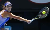 Ana Ivanovic of Serbia reaches for a backhand shot to Lucie Hradecka of Czech Republic during their women's singles first round match at the Australian Open 2015 tennis tournament in Melbourne January 19, 2015. REUTERS/Issei Kato