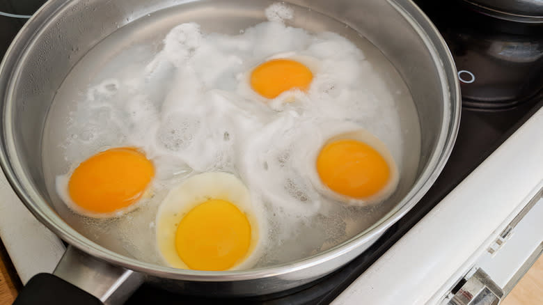 Poached eggs in cooking pan