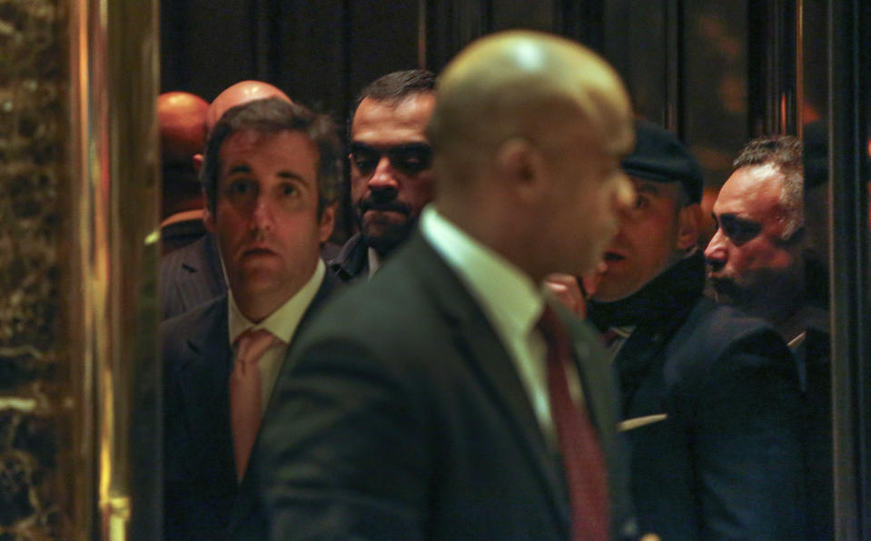 FILE - In this Dec. 12, 2016 file photo, Los Angeles venture capitalist Imaad Zuberi, far right, stands in an elevator with former Donald Trump attorney Michael Cohen, far left, at Trump Tower in New York. Federal prosecutors in New York have informed Zuberi, a major donor to President Donald Trump’s inaugural committee, that they intend to charge him with obstruction of justice and failing to register as a foreign agent. Attorneys for Zuberi filed papers late Thursday, Nov. 21, 2019, seeking a continuance of Zuberi's court proceedings in Los Angeles. (AP Photo/Kathy Willens, File)