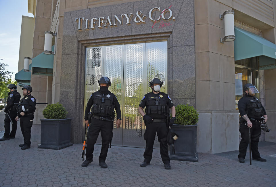 WALNUT CREEK, CA - JUNE 1: Police stand guard at the Tiffany and Co. store in downtown Walnut Creek, Calif., on Monday, June 1, 2020. Walnut Creek Police issued a curfew tonight after looters descending into downtown and looted local businesses yesterday. Over 100 police officers from agencies around the county are in Walnut Creek awaiting a Black Lives Matter Protest being held tonight. (Jose Carlos Fajardo/Digital First Media/The Mercury News via Getty Images)