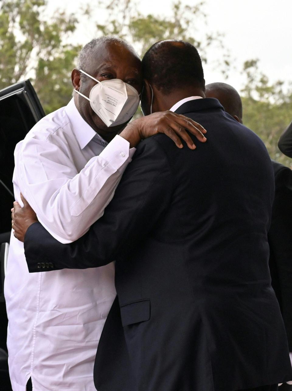 Ivory Coast president Alassane Ouattara (R) greets his predecessor Laurent Gbagbo (L) on July 27, 2021 before their meeting at the presidential palace in Abidjan. The long-awaited talks are widely seen as a key to ending Ivory Coast's political crisis, as the two headed rival factions in a post-election conflict in 2010-11 that claimed several thousand lives.